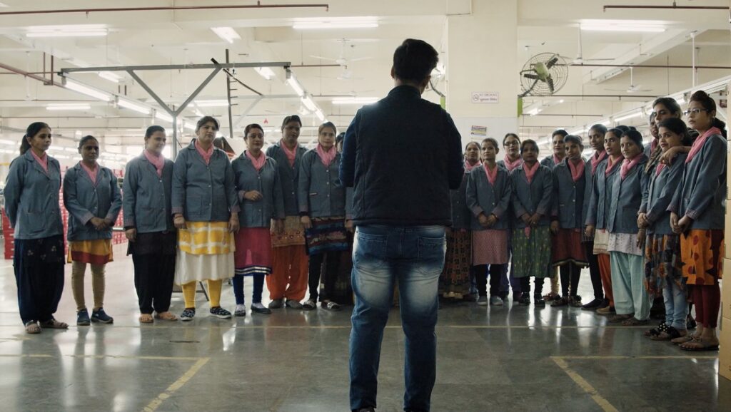 Aparna Rajawat stands in front of children in the documentary Pink Belt