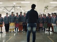 Aparna Rajawat stands in front of children in the documentary Pink Belt