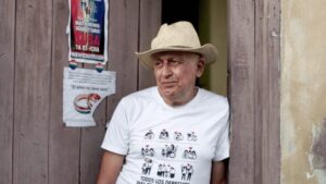 a man stands in a doorway in the documentary Quba!